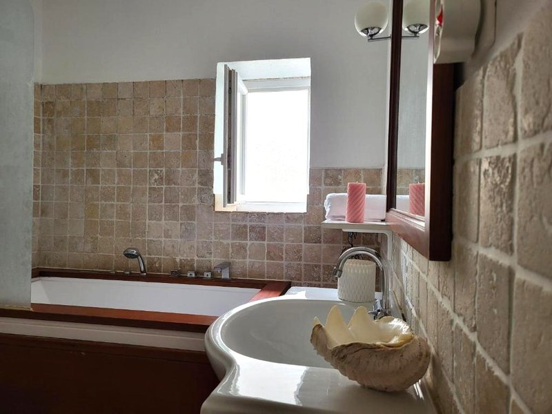 Grande chambre avec parties communes en bord de merの写真